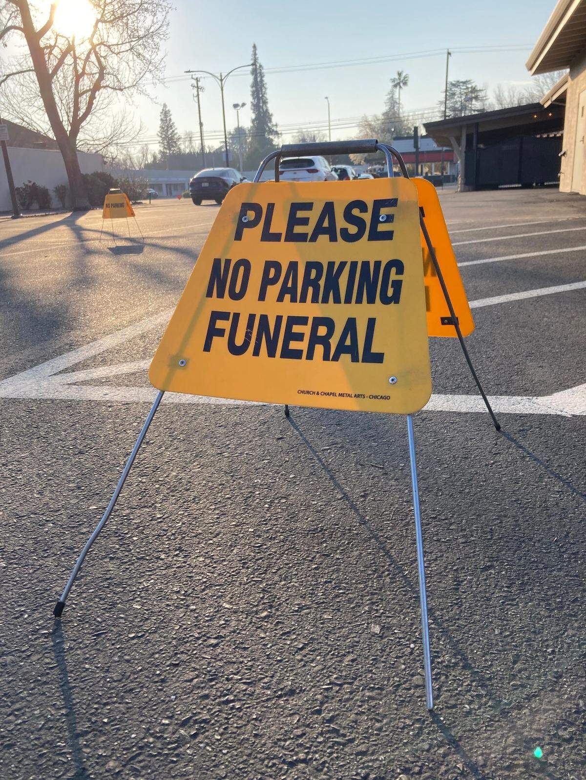 “Please, No Parking, Funeral” sign at the Franklin and Downs’ Modesto parking lot.