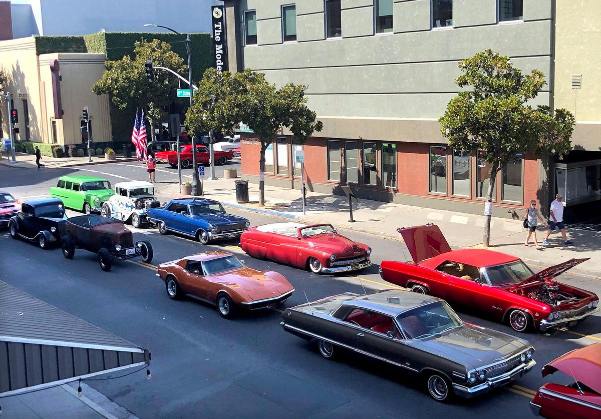 Classic cars line up on 11th street near J street for the Legends of the Cruise Walk of Fame Wednesday May 5, 2019 in downtown Modesto, Calif.