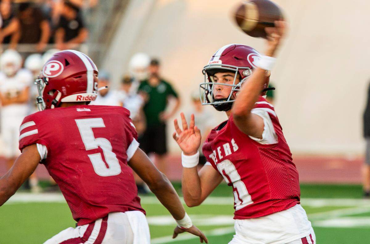 Patterson Highs, Max Medina, 3, throws a pass up field during the game with Hilmar.