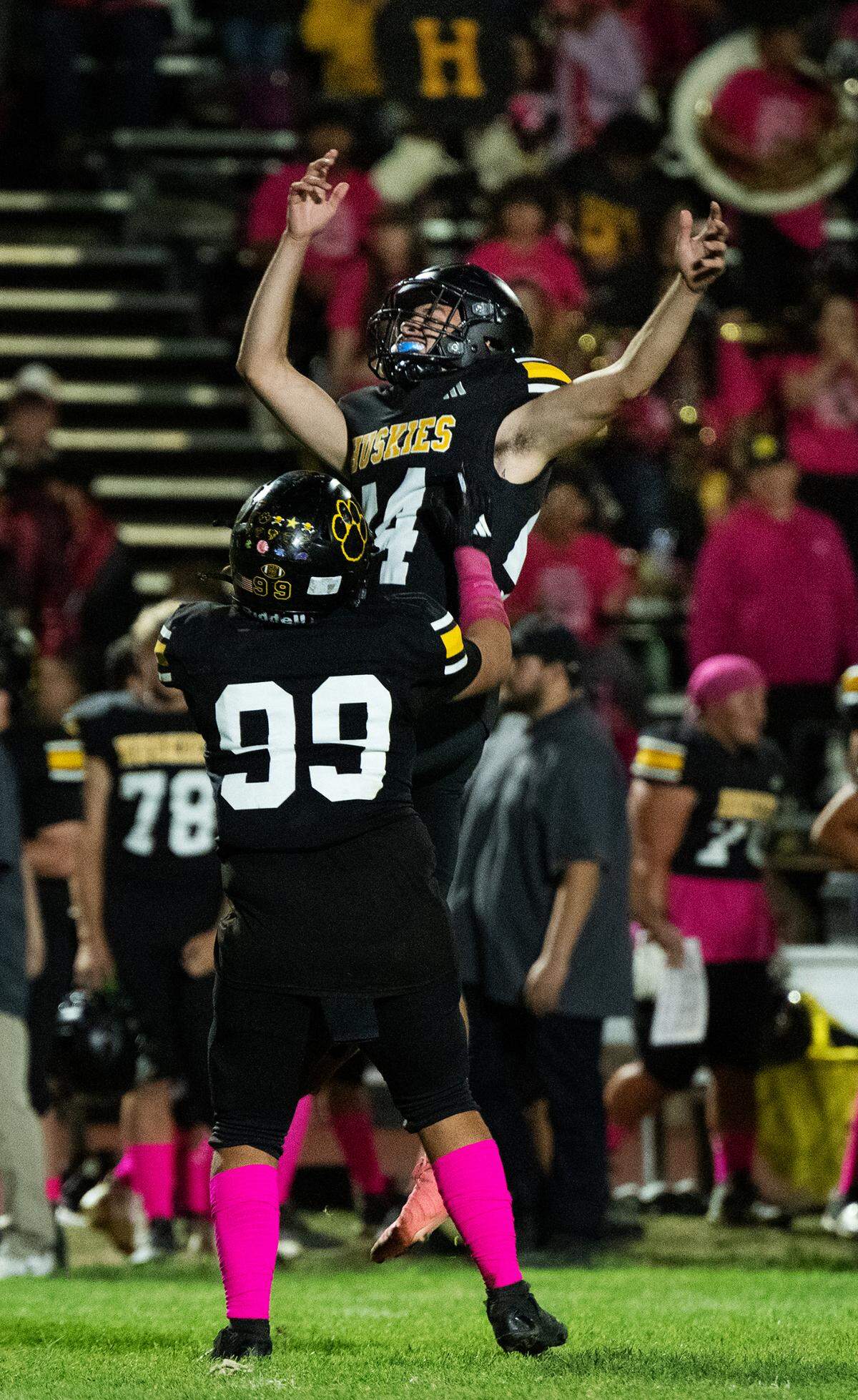Hughson’s kicker Noe Pacheco and teammate Nic Wiggs celebrate an extra point conversion during the Trans Valley League game with Sonora in Hughson, Friday, Oct. 11, 2024.