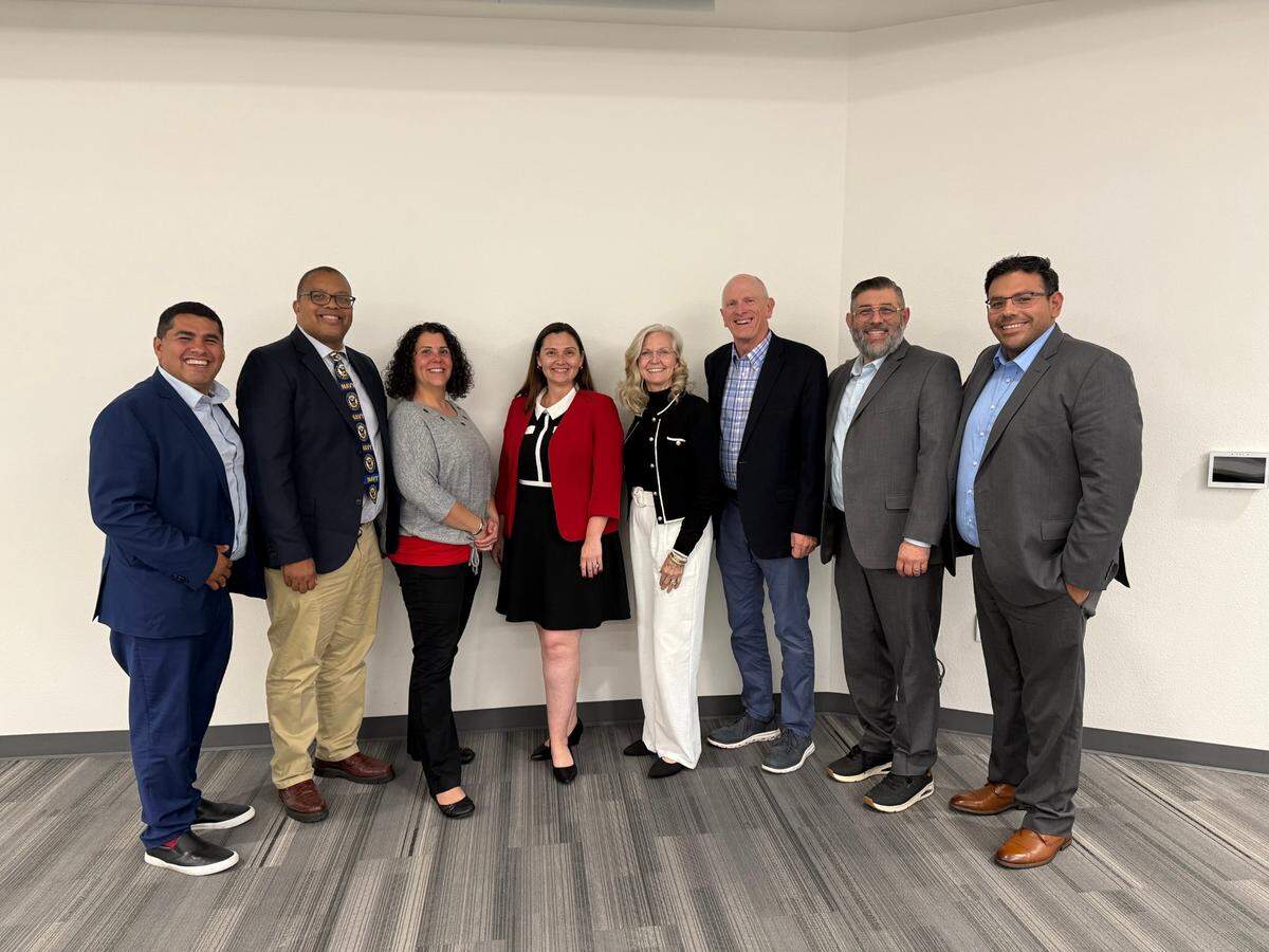 Vanessa Buitrago (fourth from left), finalist for the position of Modesto City Schools superintendent, is pictured with the MCS Board of Education.