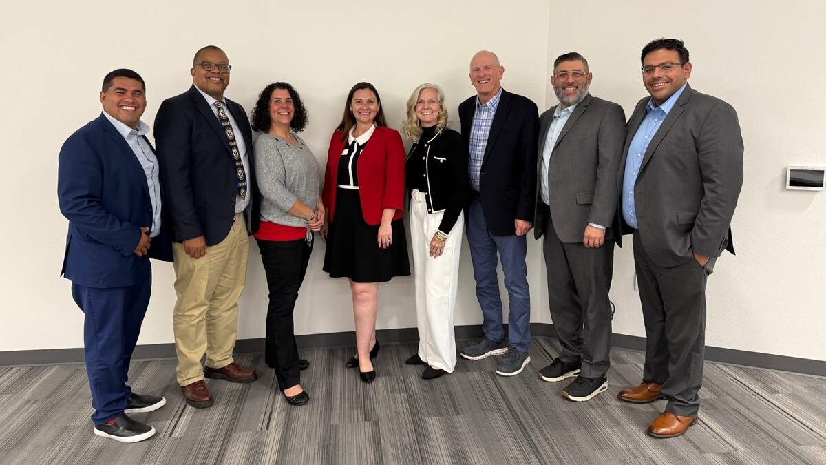 Vanessa Buitrago (fourth from left), at the time a finalist for the position of Modesto City Schools superintendent, is pictured with the MCS Board of Education in April 2025.