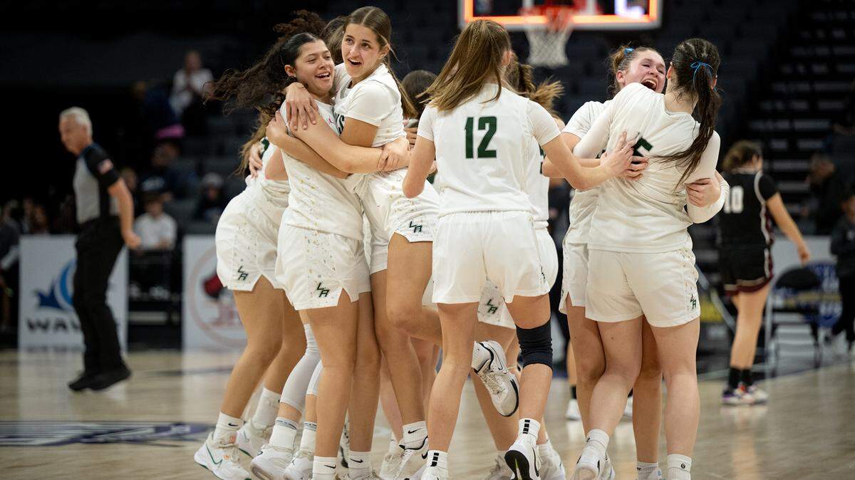 Liberty Ranch players celebrate their 55-50 win over Riverbank in the Sac-Joaquin Section Division IV championship game at the Golden 1 Center in Sacramento on Thursday.