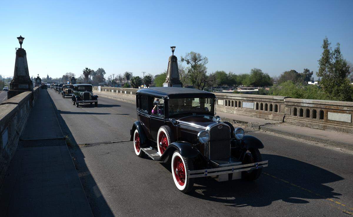 Model A owners make a ceremonial pass over the Seventh Street Bridge in Modesto, Wednesday, March 18, 2026. The bridge, opened in 1917, will be demolished and replaced with a four-lane span.