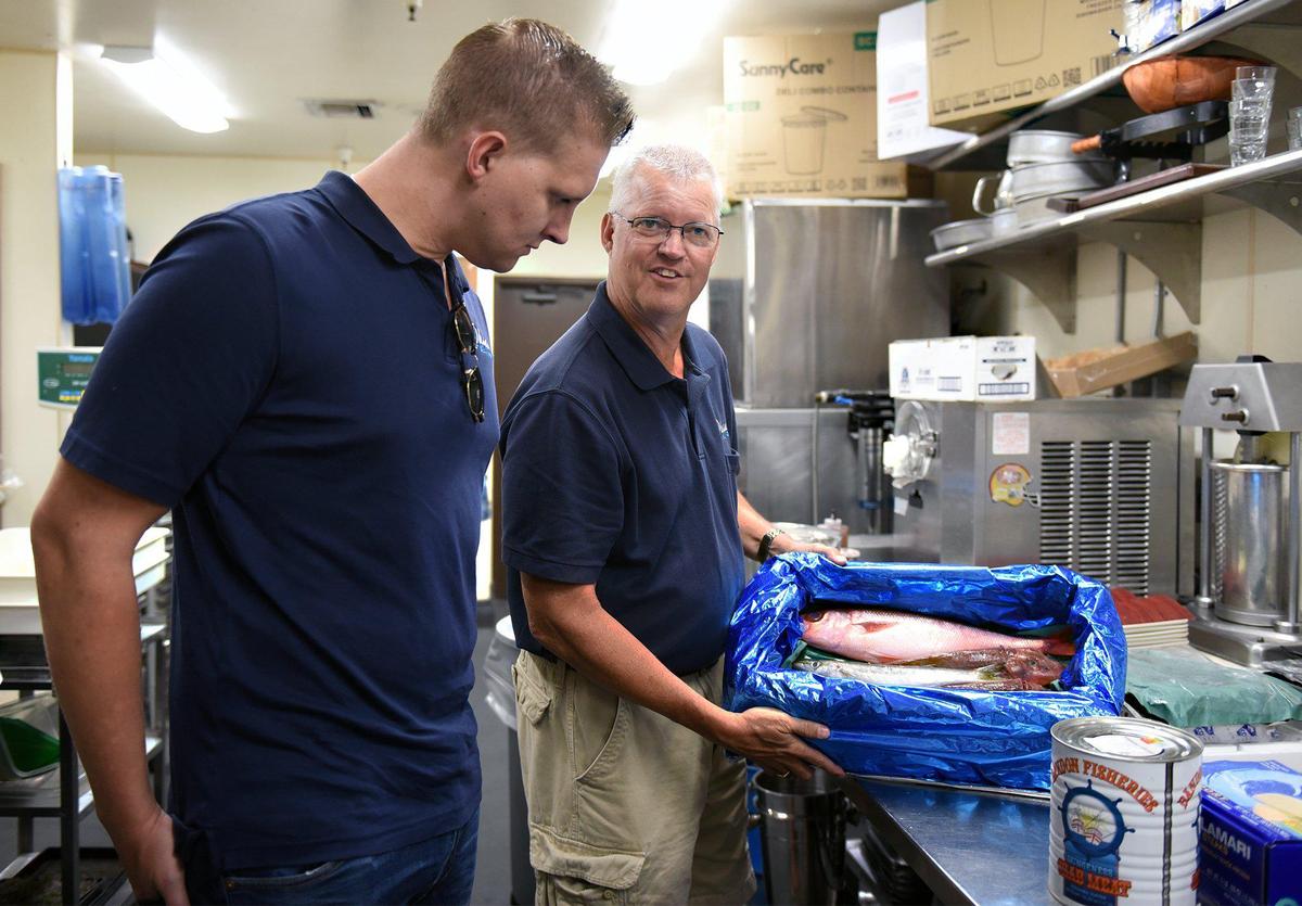 Jason (left) and John L. Mensonides are pictured with a fish delivery at Galletto on Thursday August 8, 2019 in downtown Modesto, Calif. The seafood distribution business Ohana Seafood, run by the father and son pictured here, provides fresh seafood to many of Modesto’s fine dining establishments.