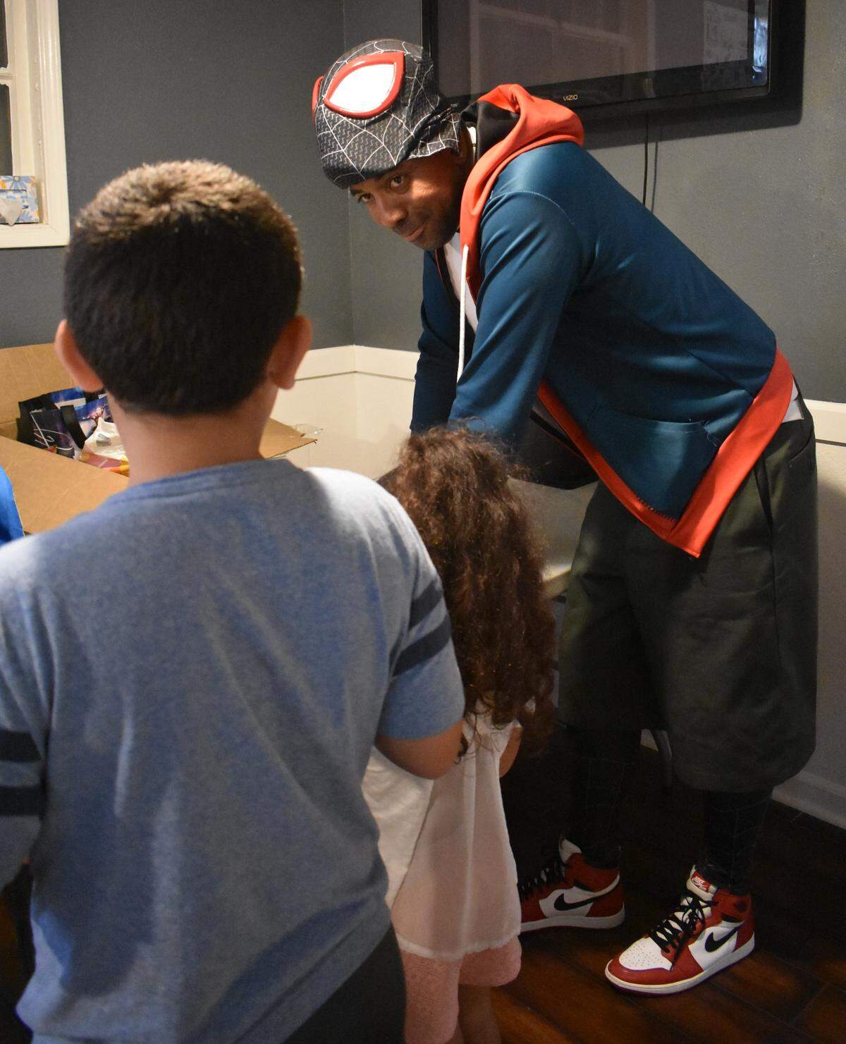 Yuri Williams of Long Beach offers kids school supplies and treats like slap bracelets on Sunday, Aug. 11, 2019, at Haven Youth Center on H Street in downtown Modesto.
