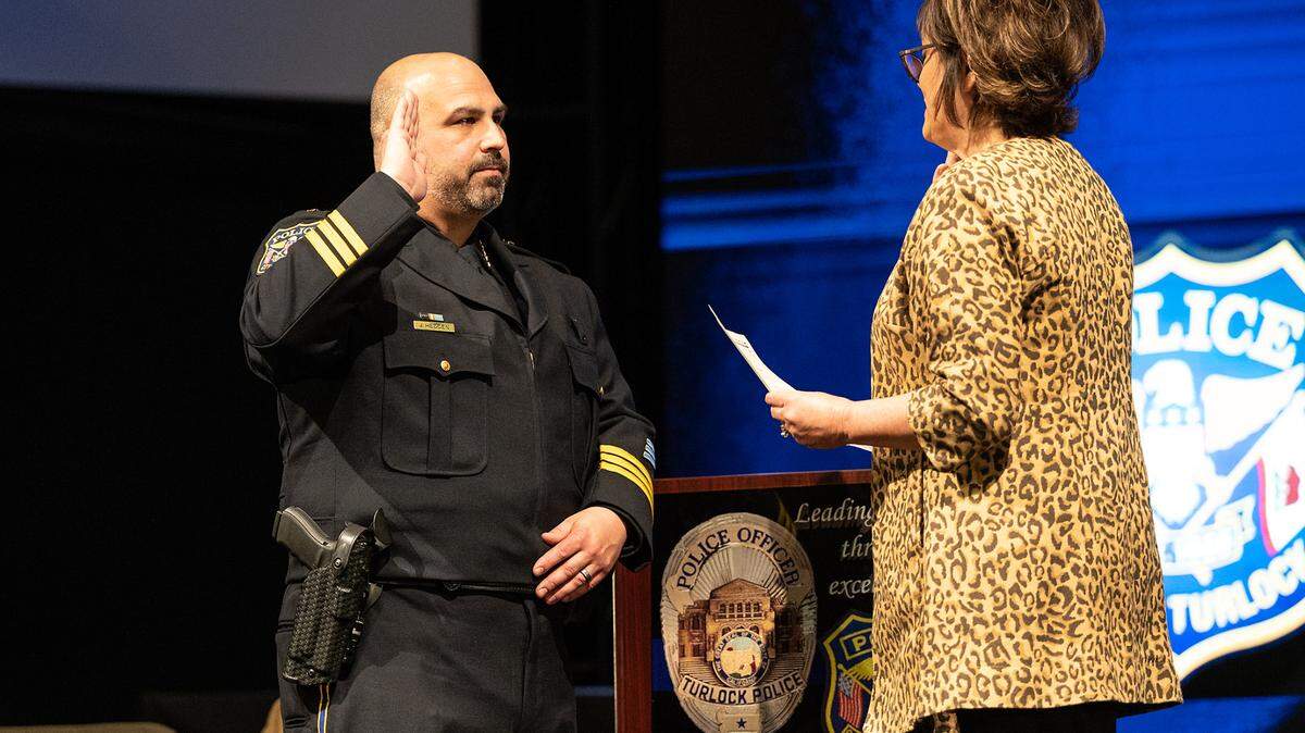 Turlock Police Chief Jason Hedden is sworn in during a ceremony at Harvest Church in Turlock on Feb. 16, 2022.