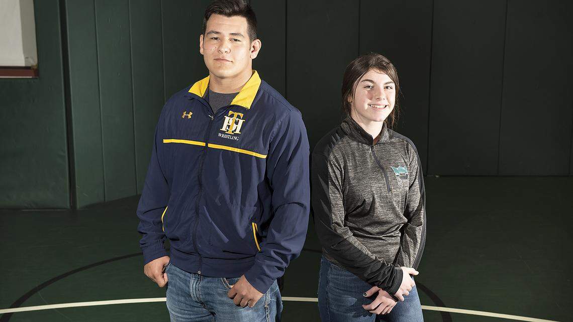 The Modesto Bee’s Wrestlers of the Year, Turlock’s Michael Jeffus, left, and Pitman’s Lilly Freitas, right, in Turlock, Calif., Wednesday, March 13, 2019. 