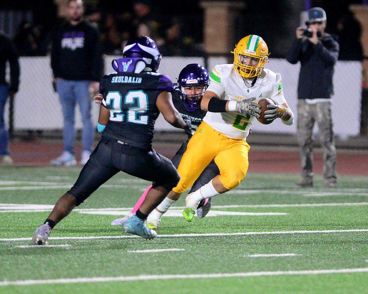 Davis receiver Miguel Olvera Deanda (2) eyes a Johansen defender during a game between Johansen and Davis at Johansen High School in Modesto California on November 1, 2024.