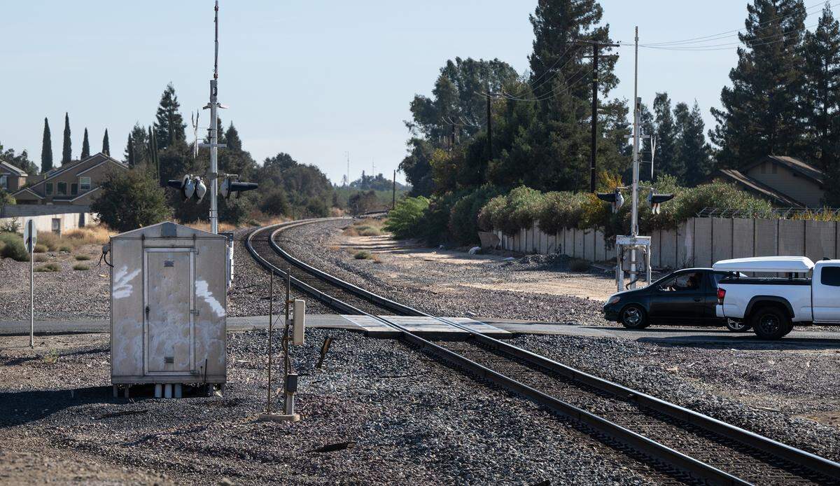 Vehicles cross the rail tracks at Parker Road in Modesto, Thursday, Oct. 31, 2024.