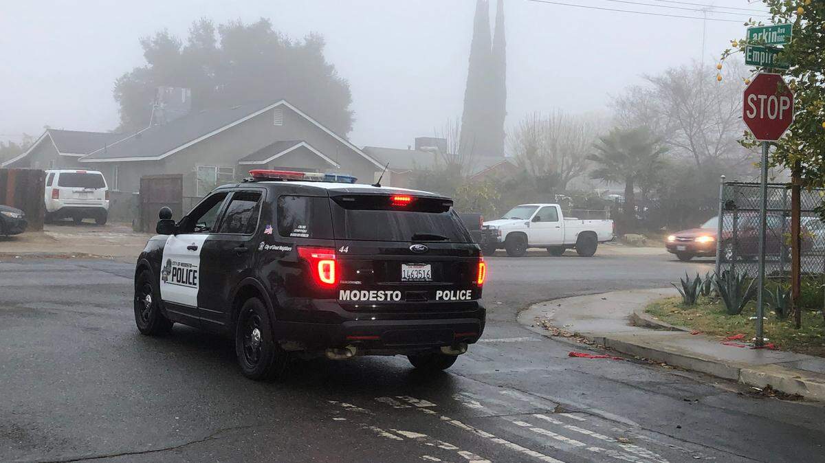 A Modesto police officer patrols the area of Larkin and Empire avenues in south Modesto on Monday morning, Dec. 21, 2020. A person was fatally shot near the intersection late Sunday night.