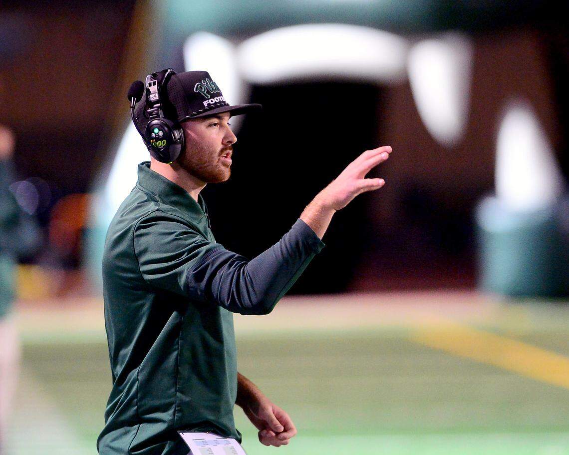 Pitman Head Coach Braden Plaa calls a play from the sidelines during the game with Modesto at Turlock High School in Turlock, Oct. 3, 2025.