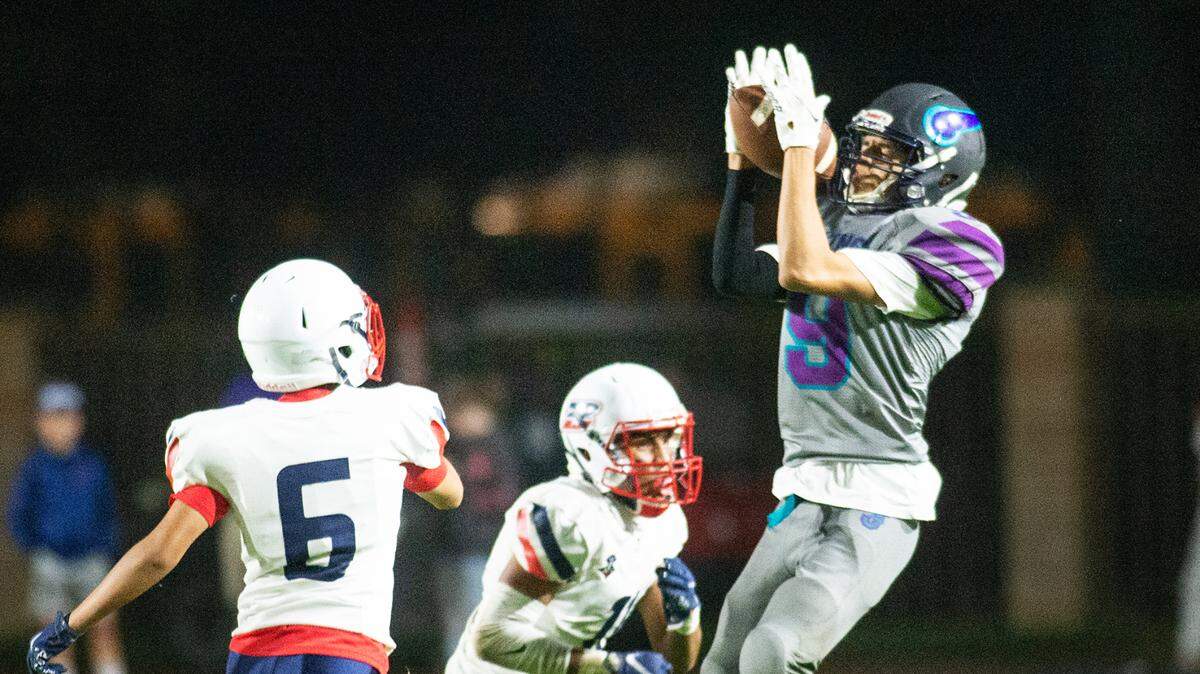 Johansen’s Brian Barrios-Ramirez makes a catch during the Western Athletic Conference game with Beyer at Johansen High School in Modesto, Calif., on Friday, Oct. 29, 2021.