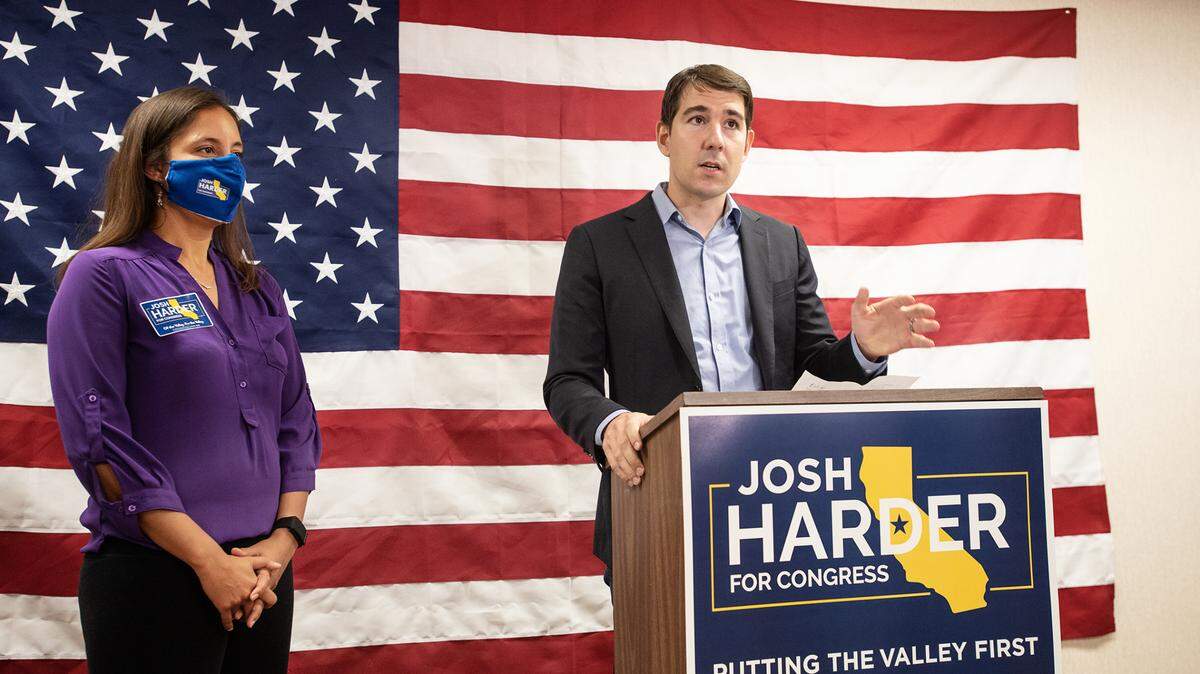 Congressman Josh Harder, and his wife, Pam, talk to the media in downtown Modesto, California, on Tuesday, Nov. 3, 2020.