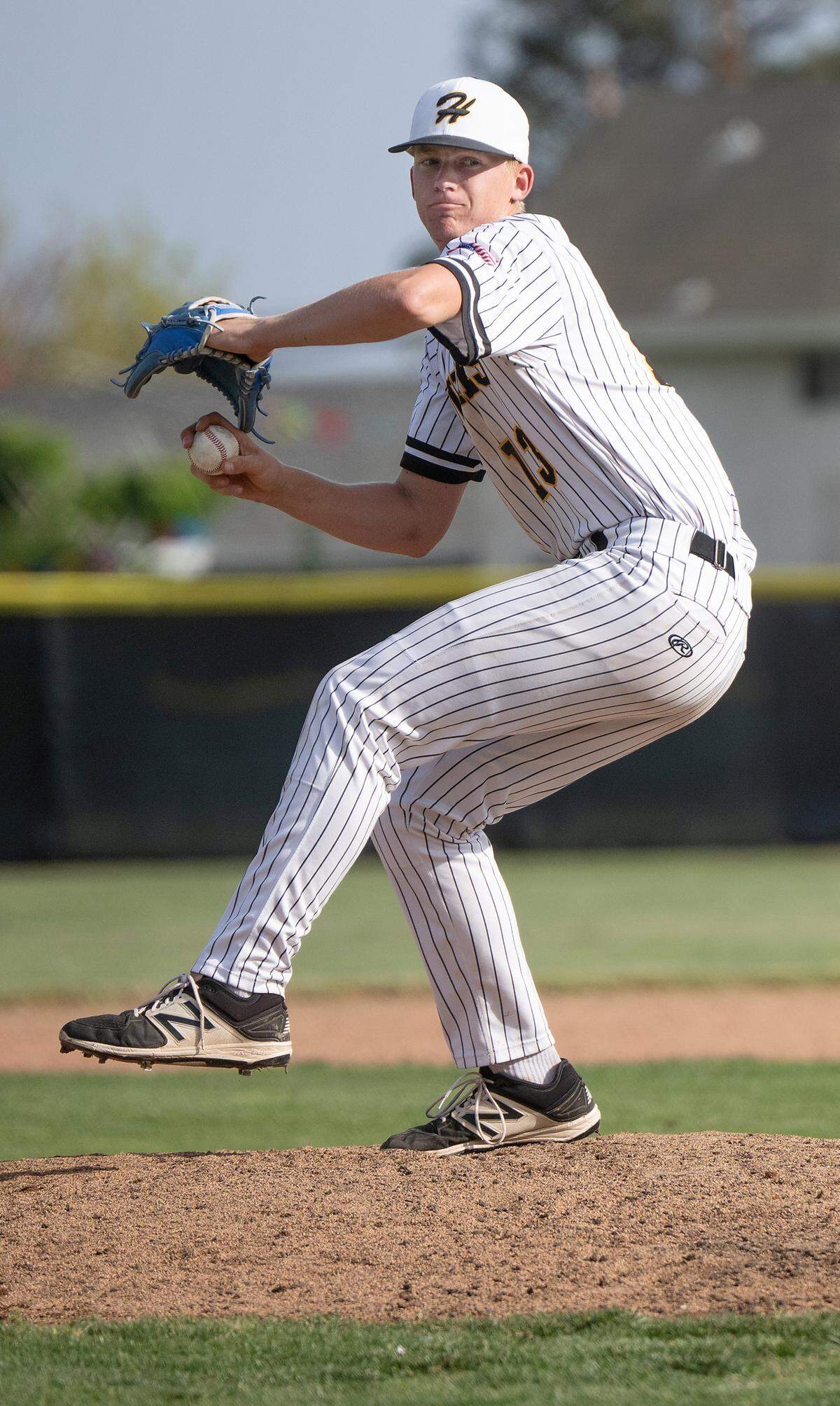 Hughson’s Bryce McDaniel delivers a pitch during the Trans-Valley League game with Hilmar at Hughson High School in Hughson, Thursday, April 17, 2025.