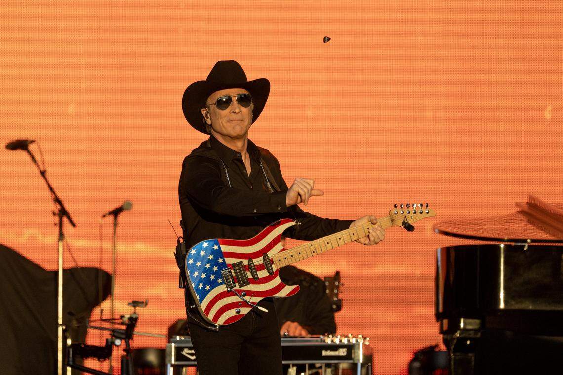 Clint Black throws his pick into the audience during the 2024 GoldenSky Country Music Festival in Sacramento.