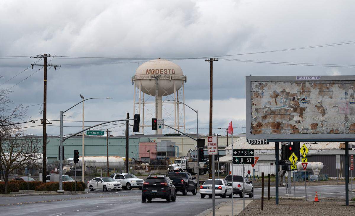 A rain storm passes through Modesto seen from Tuolumne Boulevard in Modesto, Calif., Tuesday, March 21, 2023.