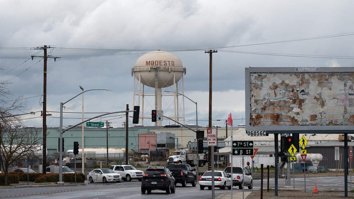 A rain storm passes through Modesto seen from Tuolumne Boulevard in Modesto, Calif., Tuesday, March 21, 2023.