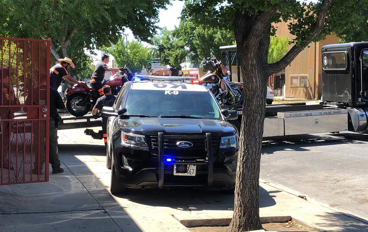 FBI and ATF agents and Modesto police officers served search warrants at the Seventh Street clubhouse of the Hells Angels motorcycle club in downtown Modesto, Calif. on Tuesday morning, June 25, 2019. Taken from the building were several bags of property and three motorcycles, which were loaded onto flatbed tow trucks.