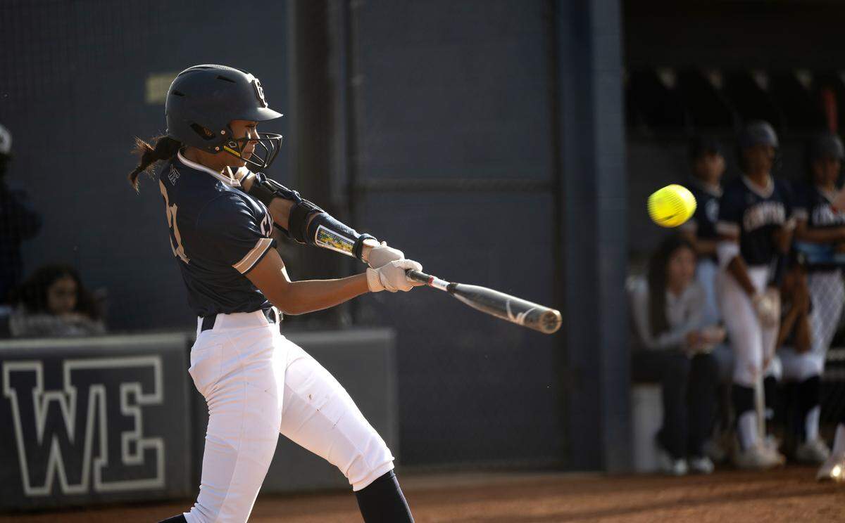 Central Catholic’s Ceriah Fitzhugh drives in runners with a double during the Valley Oak League game with Kimball at Central Catholic High School in Modesto, Calif., Tuesday, March 26, 2024. Central Catholic won the game 9-6.