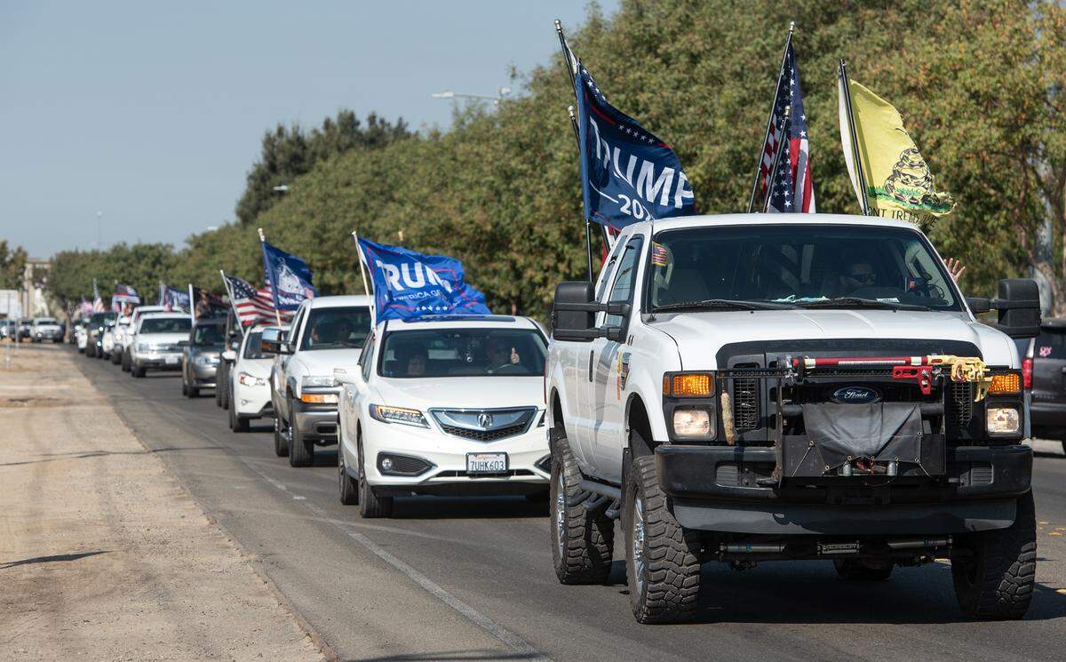 Hundreds of Donald Trump supporters drive on Tegner Road to rally for the president’s re-election campaign in Turlock, Calif., on Saturday, Oct. 17, 2020.