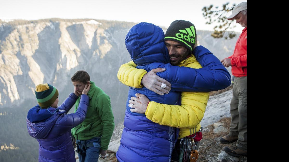 
Kevin Jorgeson, foreground, celebrates after completing a free climb summit of the Dawn Wall of El Capitan on Jan. 14. At left is Tommy Caldwell.
