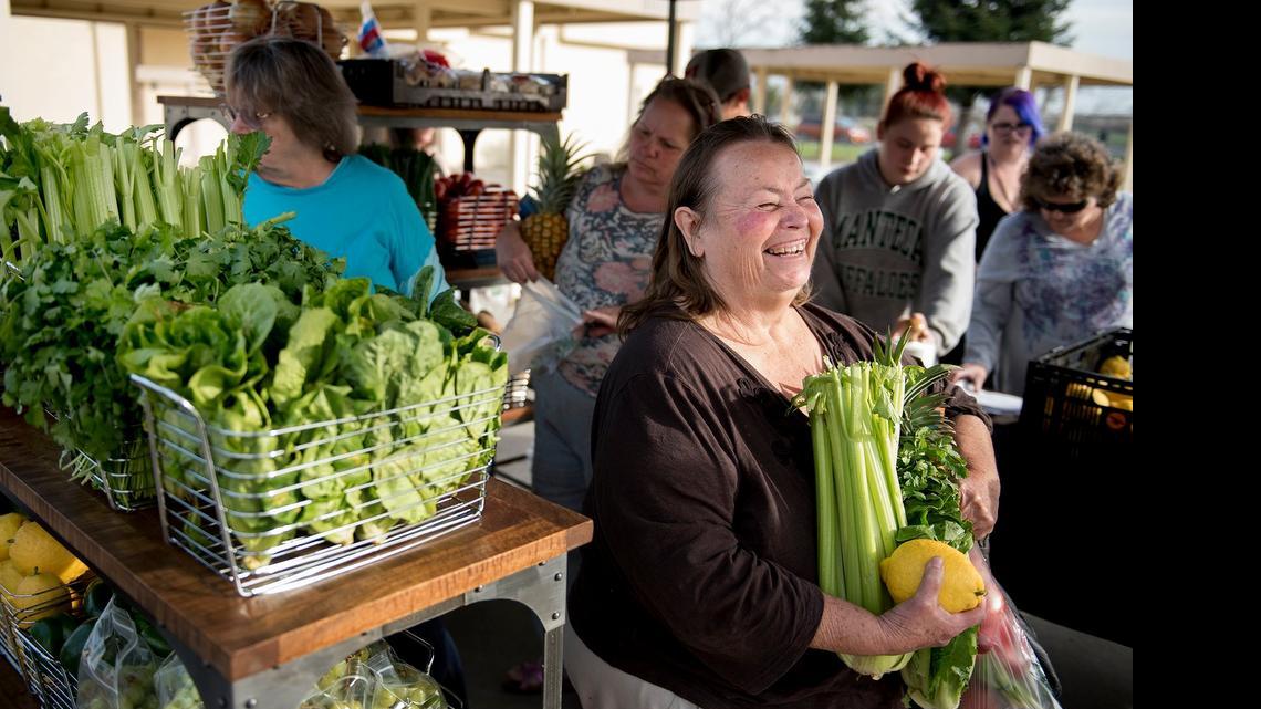 
People pick up groceries in February during the Interfaith Ministries Free Mobile Farmers Market in Empire.
