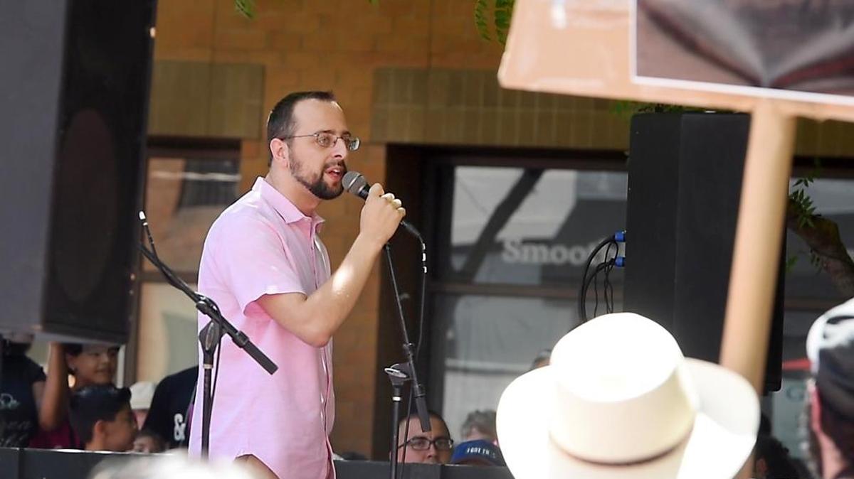 Patrick Kolasinski speaks to the crowd gathered during the Families Belong Together protest at 10th Street Plaza in Modesto, Calif., Saturday, June 30, 2018.