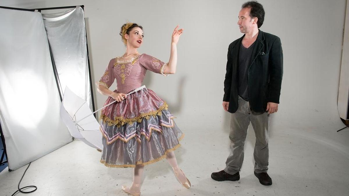 Central West Ballet artistic director Ren Daveluy works with dancer Nicole Firpo at the Modesto Bee studio.