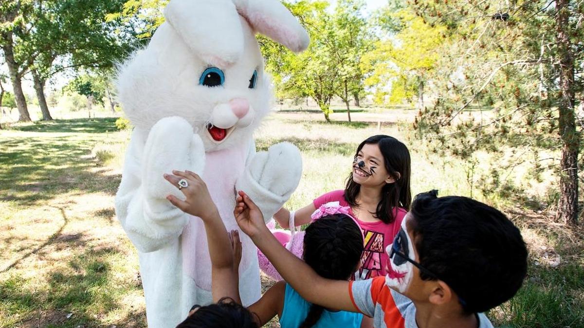 Kids say hello to the Easter Bunny at the 2015 Easter Egg Hunt event at Modesto Reservoir in Waterford.