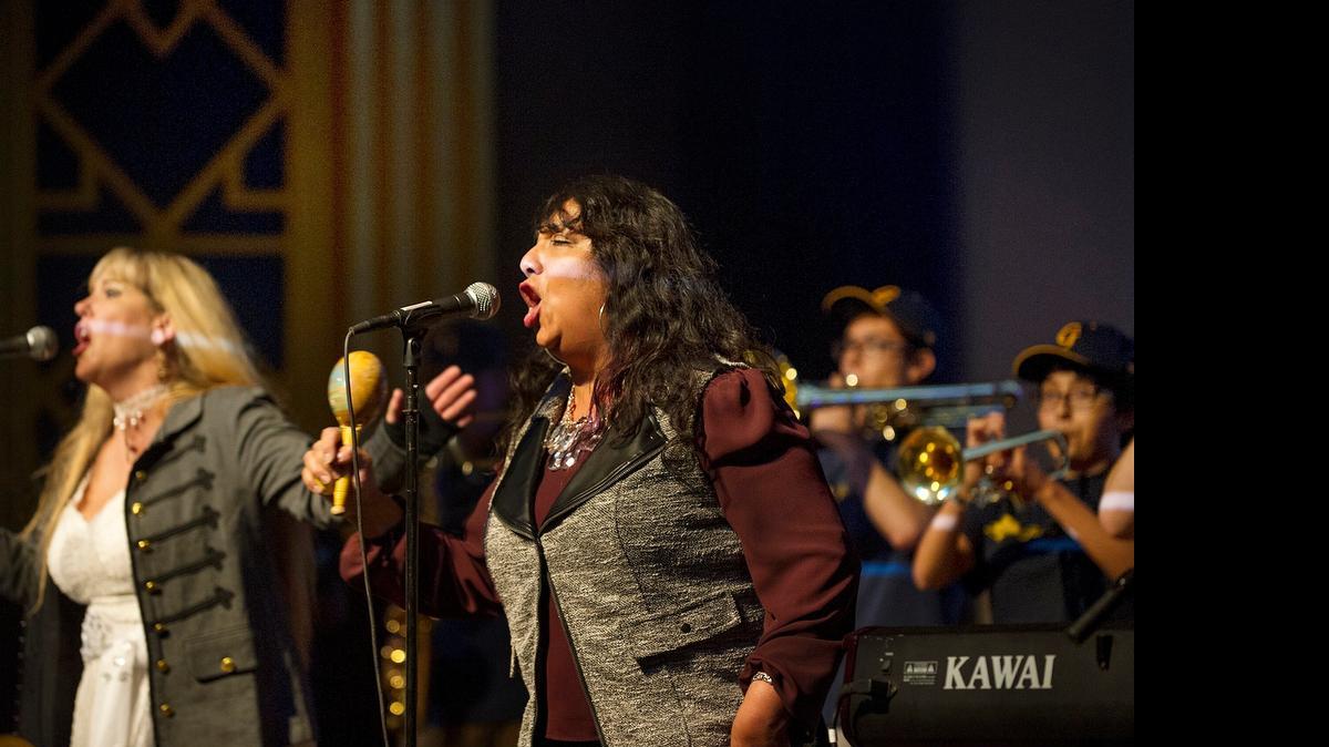 
Best singer-songwriter winner Patty Castillo Davis, foreground, performs with the Modesto Super Band and the Gregori High School band during the Modesto Area Music Association Awards show at the State Theatre in Modesto in October.
