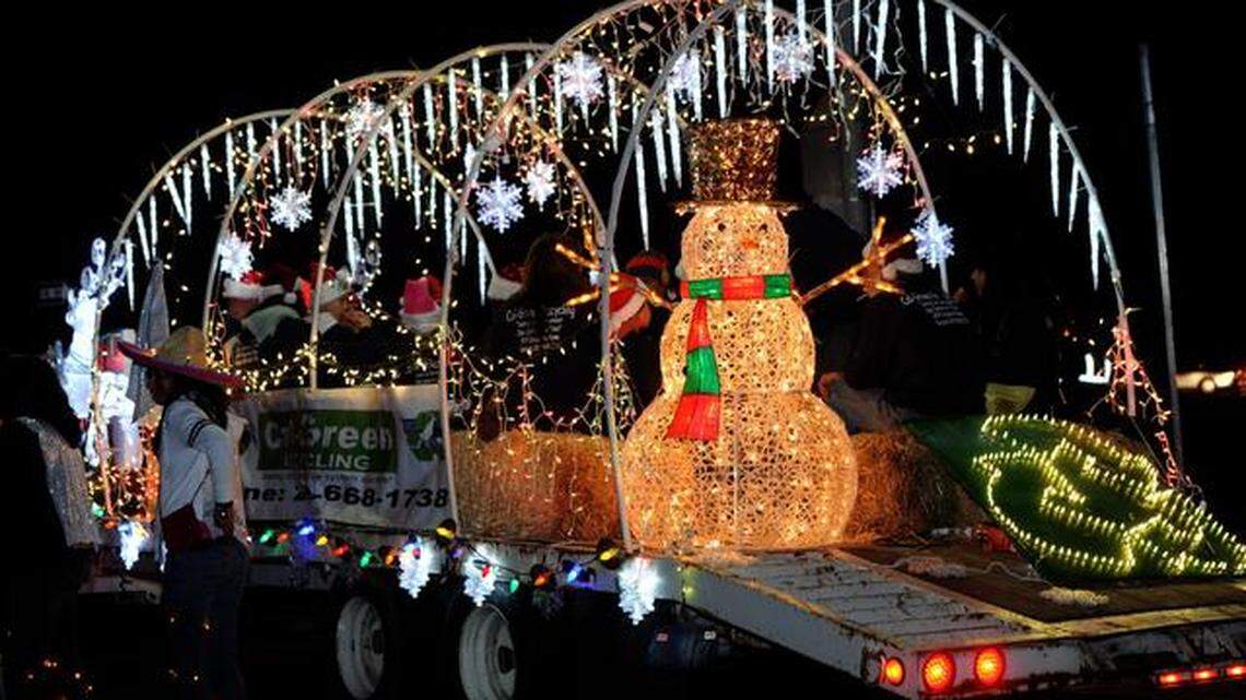 A lighted snowman and icicles decorate a float seen during the Turlock Downtown Christmas Parade in 2012. Whether the city holds the event in 2021 is to be determined because of state COVID-19 guidance.