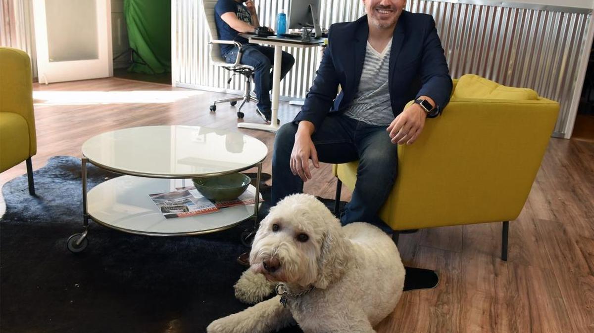 Mike Daniel of Final Cut Media, with his dog Skeeter in his office in downtown Modesto.