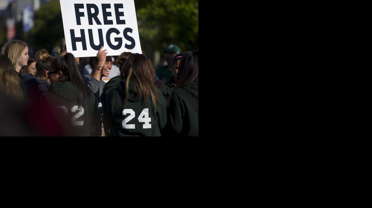 
“Free hugs” are offered during Love Modesto 2014. Volunteers are needed April 18 to help with this year’s Love Modesto family-friendly projects throughout Stanislaus County.
