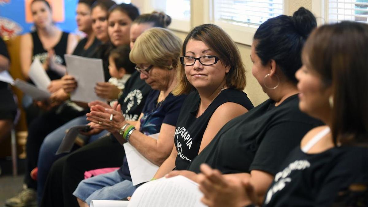 
Maria Aguilera, center, shares a moment with Irma Perez after giving her testimony during a 2015 promotoras meeting at the Family Resource Center in Oakdale. Promotoras, a predominantly Latina and women-led workforce, connect underserved communities to culturally and linguistically relevant education and essential services.