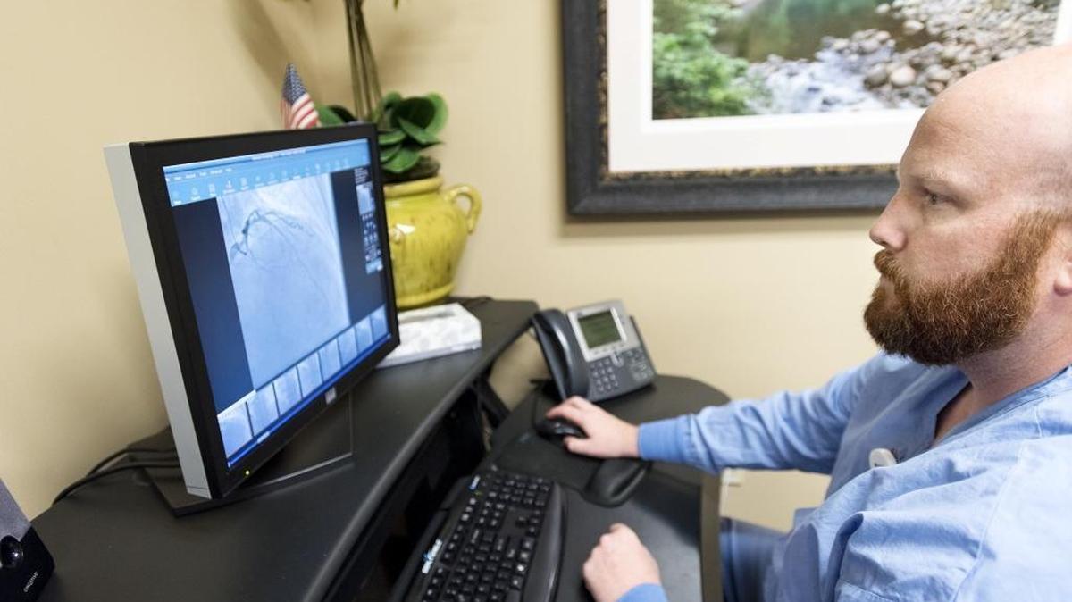 Director of Cardiovascular Services Randy Jenks looks at a fluoroscopy of a heart stent procedure at Emanuel Medical Center in Turlock, Calif., on Thursday, Nov. 17, 2016. The center has started to use dissolving heart stents, which were approved by the FDA in July.