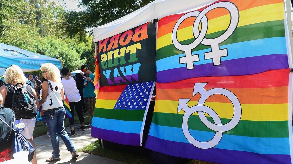 Colorful rainbow flags adorn one of the vendor booths at MoPride’s 2014 Pride in the Park event.