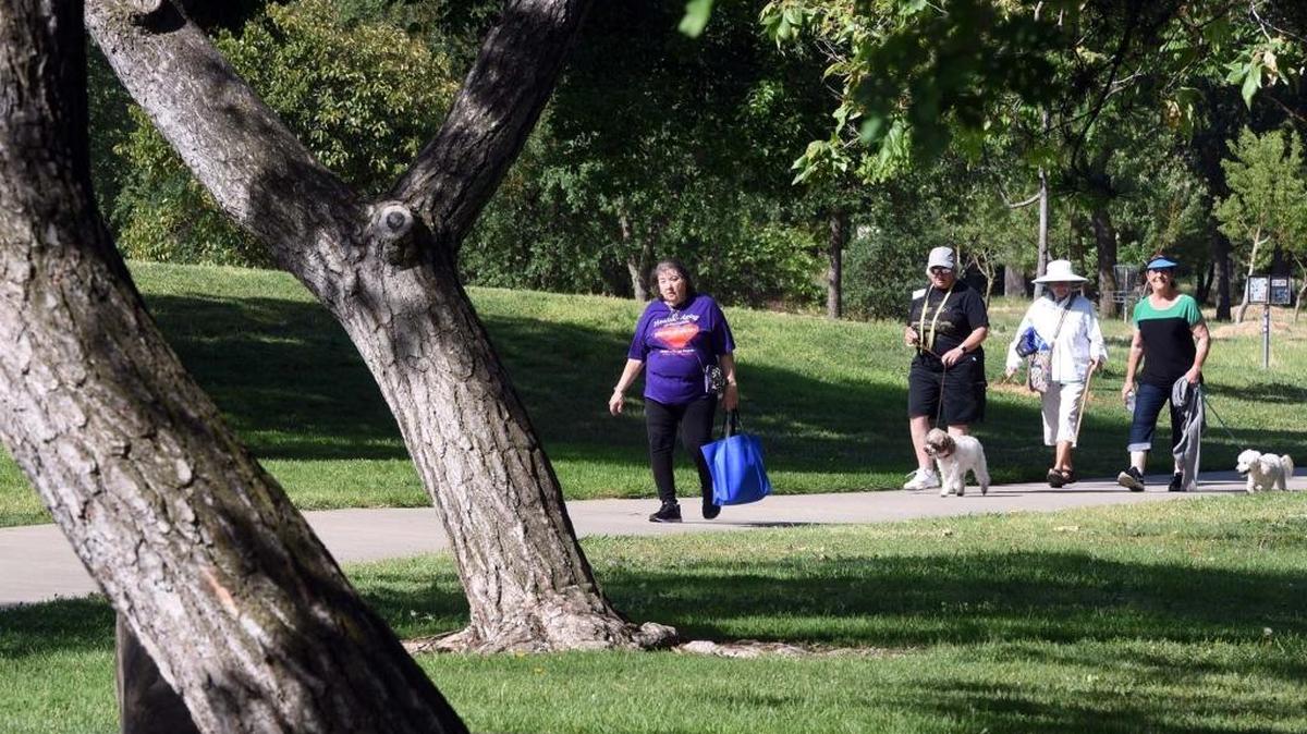 Nancy Camarda of Ripon (left) finishes a 3 mile walk Friday morning May 4, 2018 at East La Loma Park in Modesto, Calif. Camarda and others participated in the walk that was part of the 12th annual Age With Movement celebration at the park.