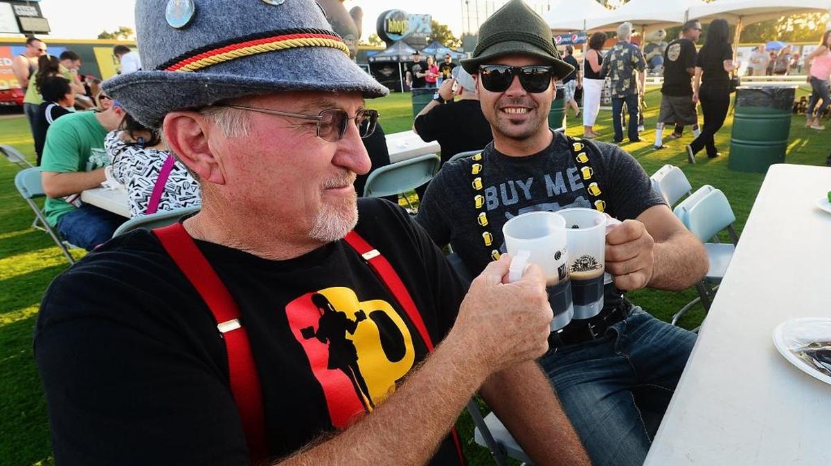 
Tom Anderson from Turlock and Dan Carreira from Oakdale toast at the Oktoberfest held at John Thurman Field, Friday, Oct. 3, 2014.
