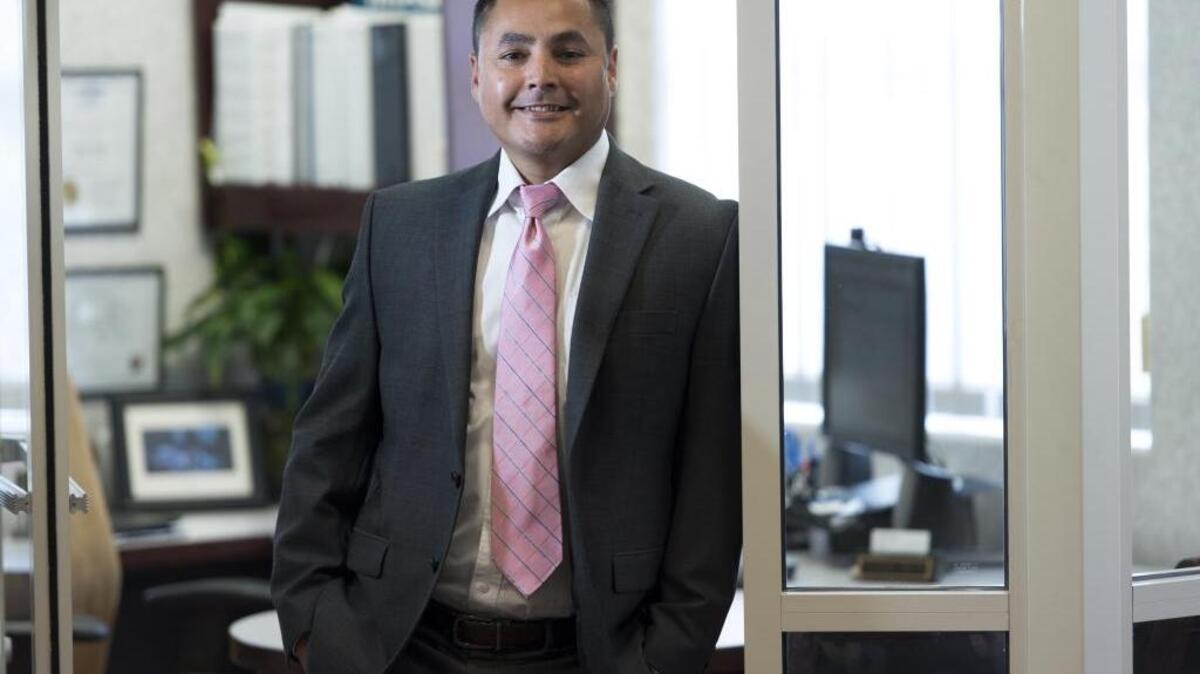 Alonzo Trejo, branch manager of the Self-Help Federal Credit Union, stands in his office Thursday, July 28, in Modesto.