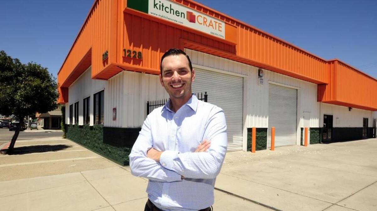 Modesto native Scott Monday, 35, CEO of kitchenCRATE & bathCRATE, stands in his front his building at Ninth and M streets in Modesto. The kitchen and bathroom renovation company was founded in 2010, and drops off large crates at homes with renovation materials for a complete remodel within seven to 10 days.