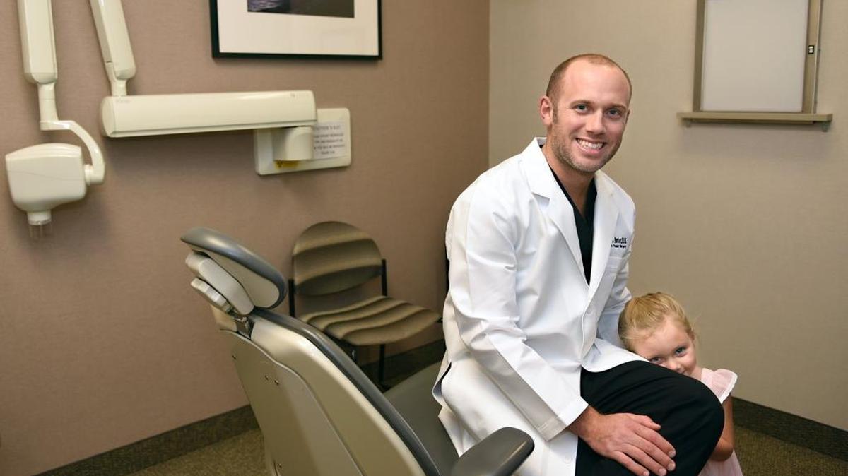 Dr. Jake Barber an Oral and Maxillofacial Surgeon and his 3-year-old daughter Brooke are pictured Friday morning August 3, 2018 at Greater Modesto Dental Implant & Oral Surgery Center in Modesto, Calif. He is a 2018 Modesto Bee 20 Under 40 honoree.