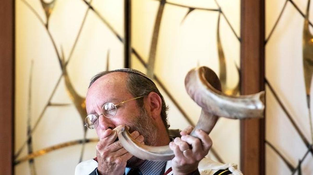 
 Bochner blows a ram’s horn, or Shofar, last month.
