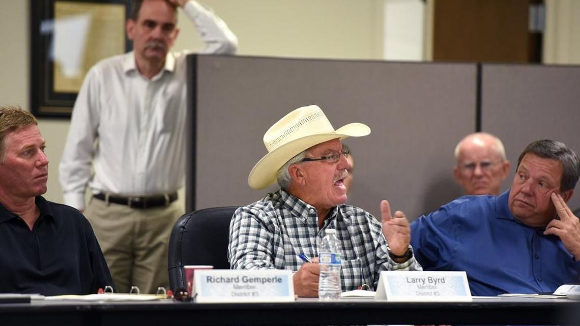 Larry Byrd, center, talks during a meeting of the Stanislaus County Water Advisory Committee on Sept. 28 in Modesto. Leslie Grover, the deputy director for water rights at the State Water Resources Control Board, defended the proposed increases in river flows.