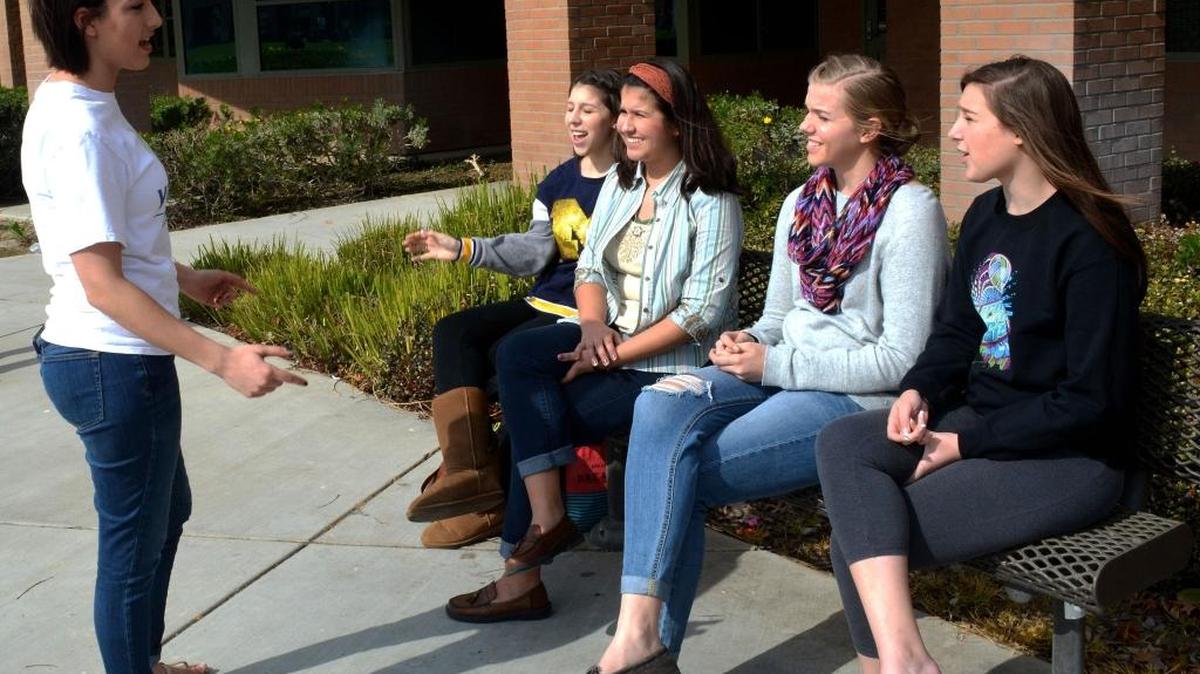 Modesto Young Life area staff associate Jennifer Hutton chats with, left to right, Natalie Giannosa, Emily Tackett, Abigail Haverdink and Megan Giannosa at Enochs High School on Friday. Hutton volunteers at the school to meet teens who could become members of the organization. Some already attend a church, others don’t. She hopes those who do can help recruit new members into the nondenominational Christian group.
