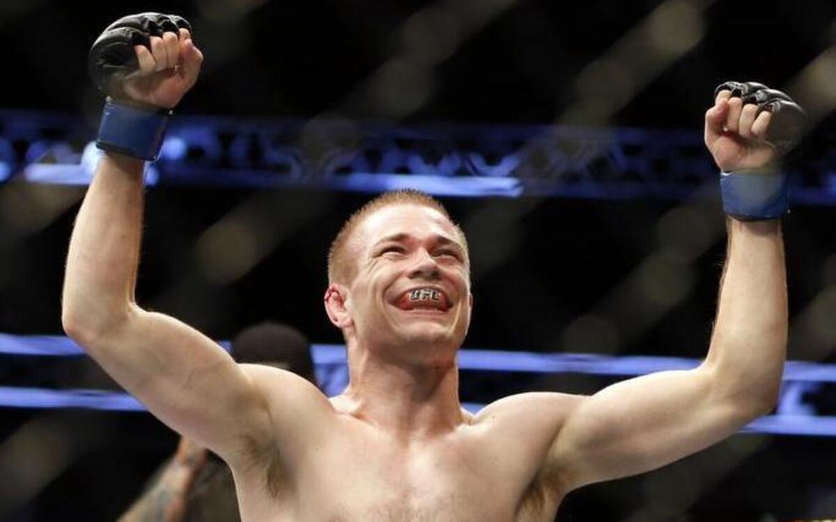 Michael McDonald celebrates a win against Brad Pickett after their UFC on Fox Sports 1 mixed martial arts bout in Boston on Aug. 17, 2013.