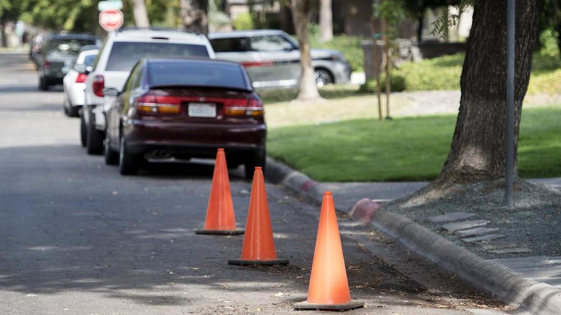Some residents on Myrtle Avenue are using cones to reserve their parking spots on the street, which is also used by students at Modesto Junior College.
