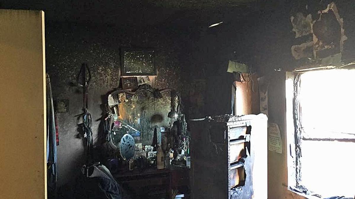 Fire damage from a home in the 200 block fo Corson Avenue in Modesto, Calif., on Tuesday, Feb. 14, 2017.