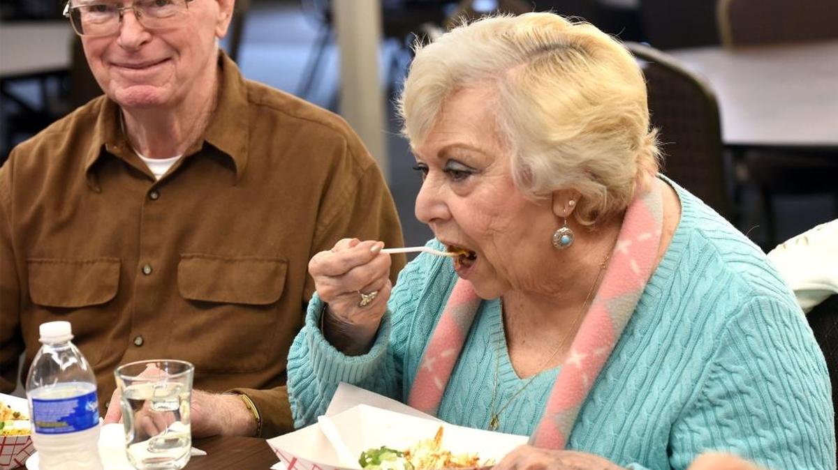Bobbi Morrison of Modesto (right) tastes a Chinook Chili Burger as her husband Don sits nearby on Thursday January 18, 2018 at the Stanislaus Veterans Center in Modesto, Calif.