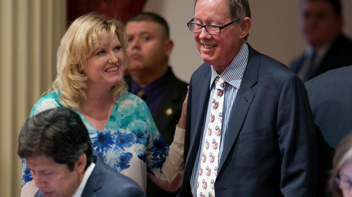 State Sen. Cathleen Galgiani, D-Stockton,top left, smiles at Sen. Tom Berryhill, R-Twain Harte, after he crossed party lines to provide the vote needed to pass AB-398, one of the two climate change bills before the legislature, Monday, July 17, 2017, in Sacramento.